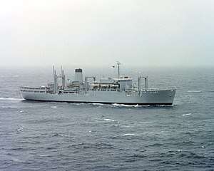 A grey ship with a helipad aft