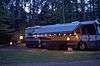 An motor home set up with party lights on the outside