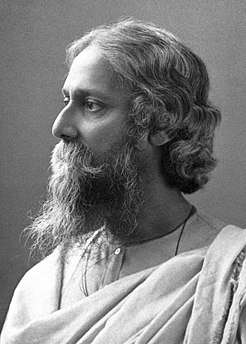 A black and white photograph of an Indian man with a beard, looking left