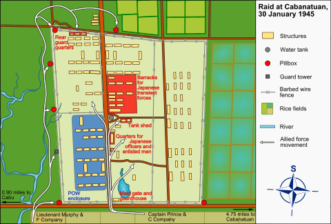 Overhead map of the layout of the prisoner camp. Arrows indicate the directions the American soldiers attacked the camp, and a legend at the right indicates the types of buildings located in the camp