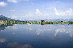 Rawa Pening reflects the clouds in its still water