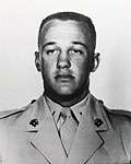 A black and white image showing the head and shoulders of Reasoner in his military dress uniform.