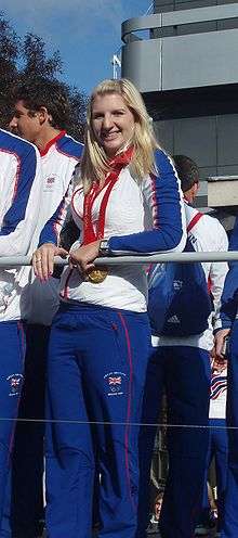 Rebecca Adlington with a gold medal around her neck with red ribbon