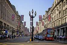 Looking north along Regent Street, with Union Flags hung between buildings
