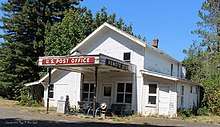 Remote, Coos County, Oregon off of present day Highway 42. Photograph of the Post Office, Store, and gas station.
