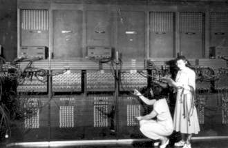 Marlyn Wescoff, standing, and Ruth Lichterman reprogram the ENIAC in 1946.