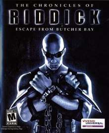 A bald man holding two knives and wearing black clothing, chains, and goggles. The man is in front of a black background with "The Chronicles of Riddick: Escape from Butcher Bay" over his head. The ESRB M rating is shown on the bottom left corner and the Vivendi Universal Games logo is on the bottom right corner.