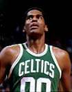 A man, wearing a green jersey with a word "CELTICS" and the number "00" written in the front, is looking up.