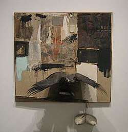  Robert Rauschenberg's Canyon combine 1959:  oil, pencil, paper, fabric, metal, cardboard box, printed paper, printed reproductions, photograph, wood, paint tube, and mirror on canvas with oil on bald eagle, string, and pillow.