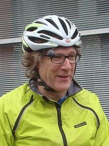 Portrait of Roger Sutton wearing a bike helmet