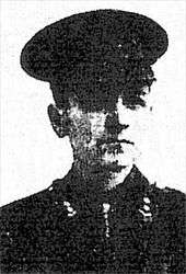 A black and white army portrait of Ronald Lindsay Johnson. He is in uniform, wearing a hat.