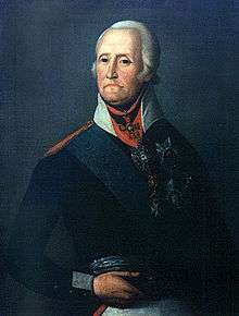Painting of a dark-eyed man with the corners of his mouth turned down. He appears to be wearing a powdered wig. He wears a dark military uniform with a white collar and a blue sash over his right shoulder, plus several military awards.
