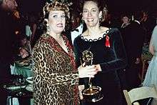 Metcalf and Rosie O'Donnell holding an Emmy