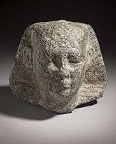 Head of a pharaoh, wearing the nemes.