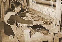 Photo of woman making a rug