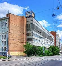 Old factory on a street with trolley tracks