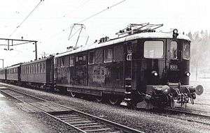 An Ae 4/6 locomotive, as new, hauling a train