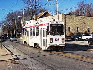 Trolley 9074 on the Route 13 line on Main Street in Darby, PA.