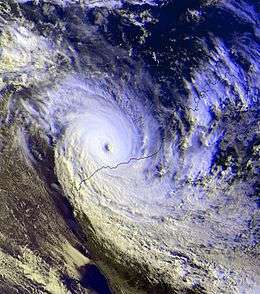 Satellite image of a powerful cyclone near the coast of Western Australia. The storm is very mature, with a large area of deep thunderstorms and a well-defined, clear eye.