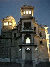 Monsoon palace at evening with interior lights on
