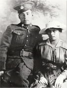 Black and white photo of Sarah and Jim Lavalley on their wedding day with Jim in military uniform