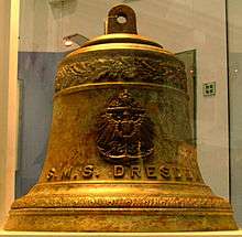 A brass bell with "S.M.S Dresden" engraved on it