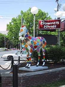 Life-sized fiberglass horse, decorated with multicolored ice-cream cones