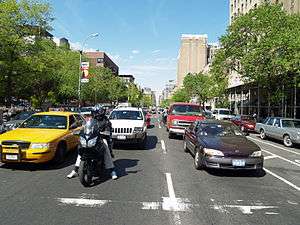 vehicles stopped at a red traffic signal on Second Avenue in Manhattan