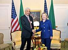 Secretary Clinton shakes hands with Libyan Foreign Minister Kousa
