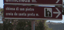 Bilingual sign pointing to a church