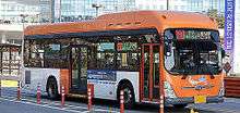 Orange-and-white bus