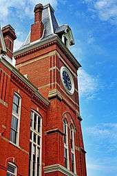 An image of the red-bricked Seney Hall and its clocktower