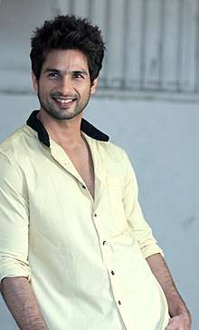 Shahid Kapoor is smiling at the camera.