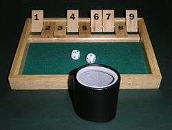 Shut the box game with dice cup