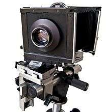 Large, boxy camera with bellows