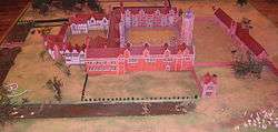 Model of Sissinghurst Castle in 1560. From right to left - gatehouse, tower, brick courtyard, wooden courtyard, moat from and left