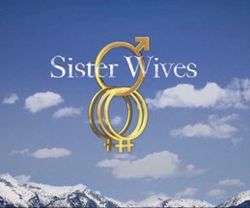 Against a backdrop of snow-covered mountains, white clouds and blue sky, the word "Sister Wives" in white text is superimposed between a gold ring resembling the male gender symbol. Dangling from that ring are three other gold rings resembling the female gender symbol.