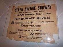 An old sign stating "Sixth Avenue Subway Will be Opened to the Public at 12-01 A.M. Sunday, December 15, 1940. There are service announcements for other subway lines as well