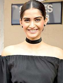 A picture of Sonam Kapoor during promotions of the film Neerja as she looks at the camera.