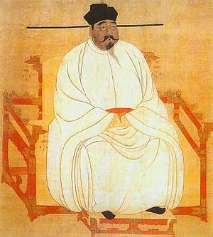 Painted image of a portly man sitting in a red throne-chair with dragon-head decorations, wearing white silk robes, black shoes, and a black hat, and sporting a black mustache and goatee