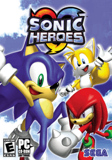 The North American PC cover art of Sonic Heroes. It depicts the cartoonish characters Sonic, a blue hedgehog, Tails, a yellow fox, and Knuckles, a red echidna, making victory poses. Above them, the text "SONIC HEROES" is shown; below them (from left to right) is the ESRB rating of E, the PC-DVD ROM logo, and the Sega logo.