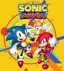 The official art of Sonic Mania. It shows Sonic, a cartoonish blue hedgehog with red shoes; Tails, a cartoonish, yellow, two-tailed fox; and Knuckles, a cartoonish red echidna with big fists against a yellow background. The words "Sonic Mania" are seen above the characters.