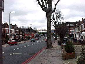 Two-lane road passing through residential neighbourhood