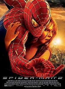 Against a New York City background, Spider-Man hugs Mary Jane Watson, with a reflection of Doctor Octopus in his eye as he shoots a web.