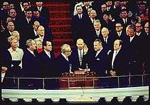 On the Inauguration podium, Agnew is sworn in as Nixon and others look on