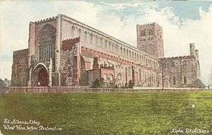 St Albans Abbey west front prior to restoration in 1880. A large perpendicular window and a flat roof.