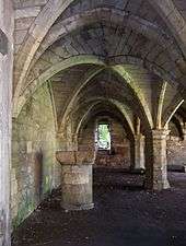 Vaulted arches seen from inside on the ground floor.