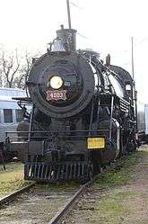 steam locomotive with headlight lit