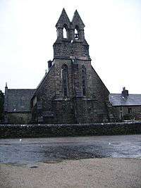 The end of a church with a twin bellcote