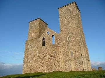 Looking up at Reculver towers from close by on a sunny day